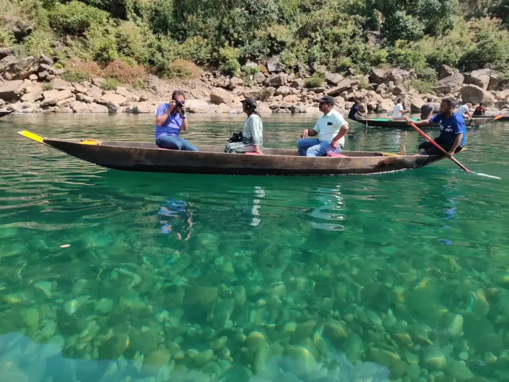 Travel group near river valley in Assam Meghalaya